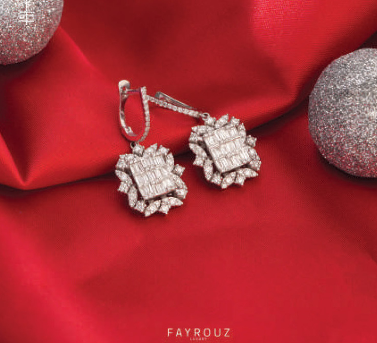Diamond earrings on red satin