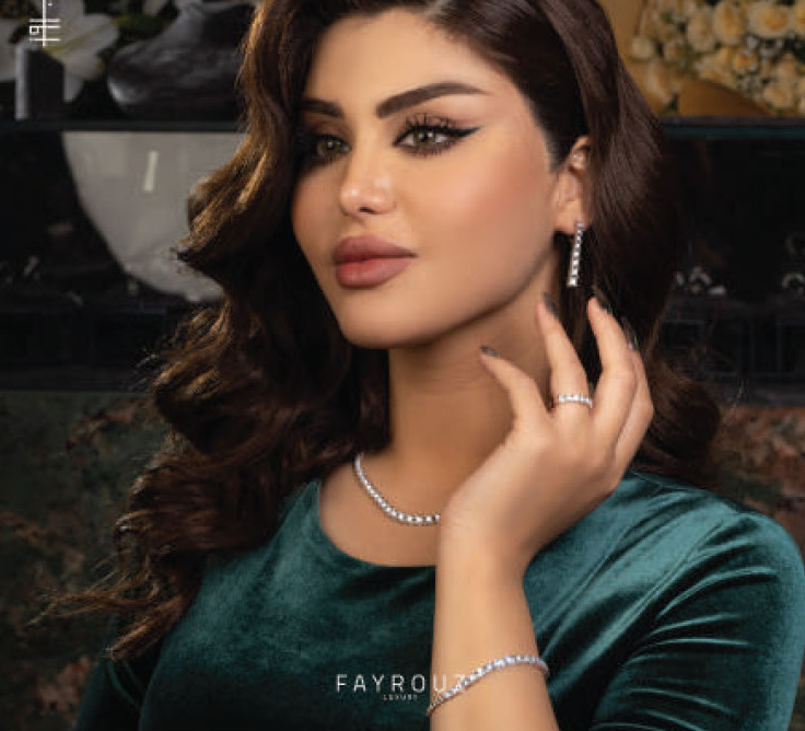 Model with drop earrings and tennis necklace