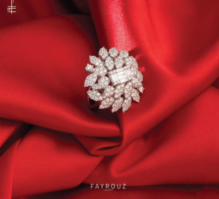Diamond cluster ring on red satin